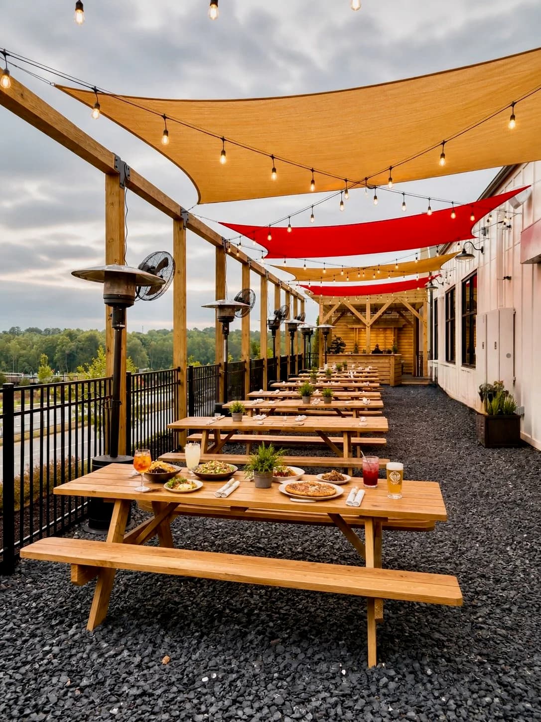 Open-air biergarten with brewery views